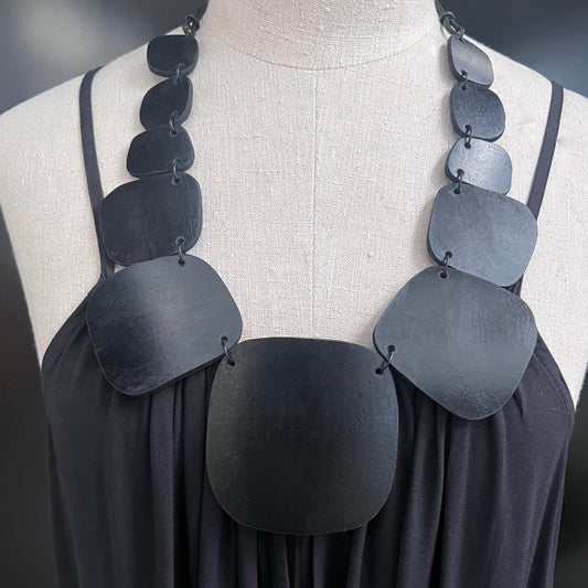 Repurposed rubber discs necklace with graduating sized elements