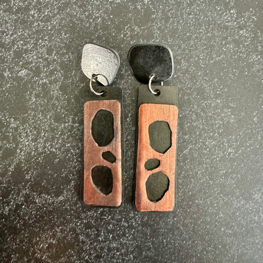 Long dangle earrings with black rubber backing and bronze painted rubber overlay