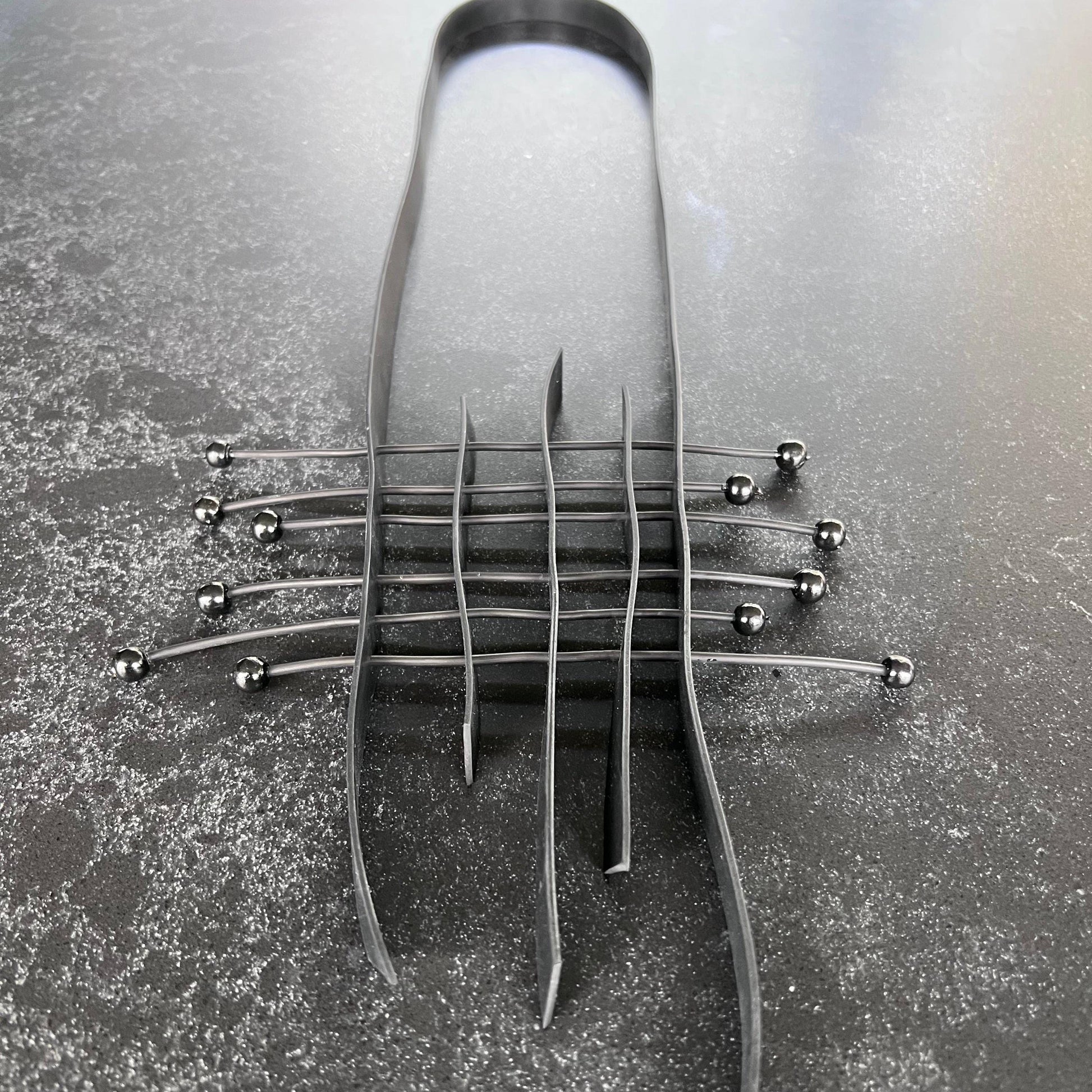 A grid style rubber necklace