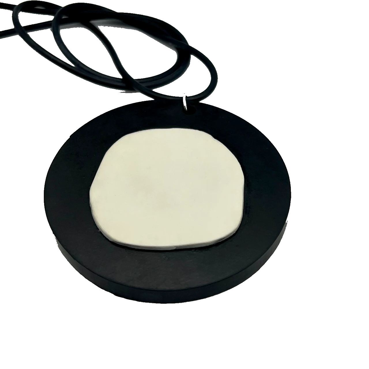 A repurposed rubber black and white pendant necklace
