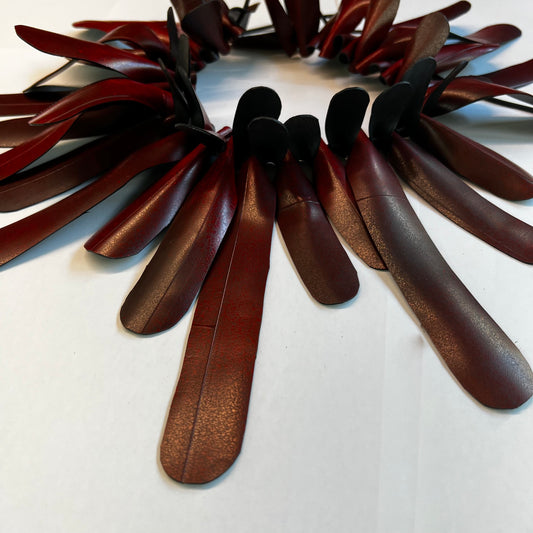 A frilly red rubber necklace