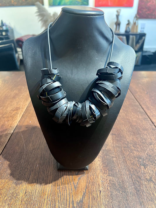 A necklace made from bicycle inner tube