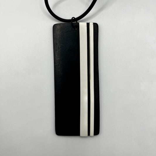 A black rectangular pendant with white GT stripes 