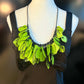 A mannequin wears a necklace made from green coloured recycled plastic