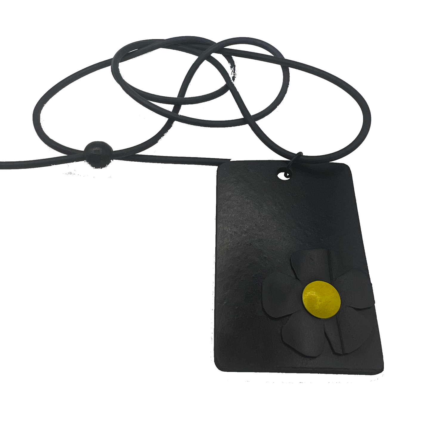 A black and yellow daisy on a rectangle black pendant