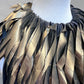 Close-up of a gold painted necklace.