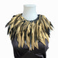 Gold feathery rubber painted necklace collar on a mannequin against a white background