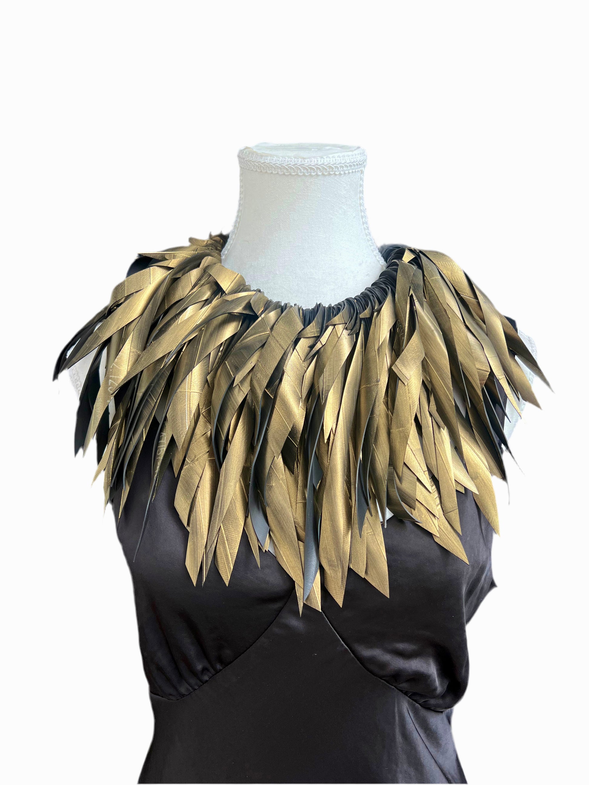 Gold feathery rubber painted necklace collar on a mannequin against a white background