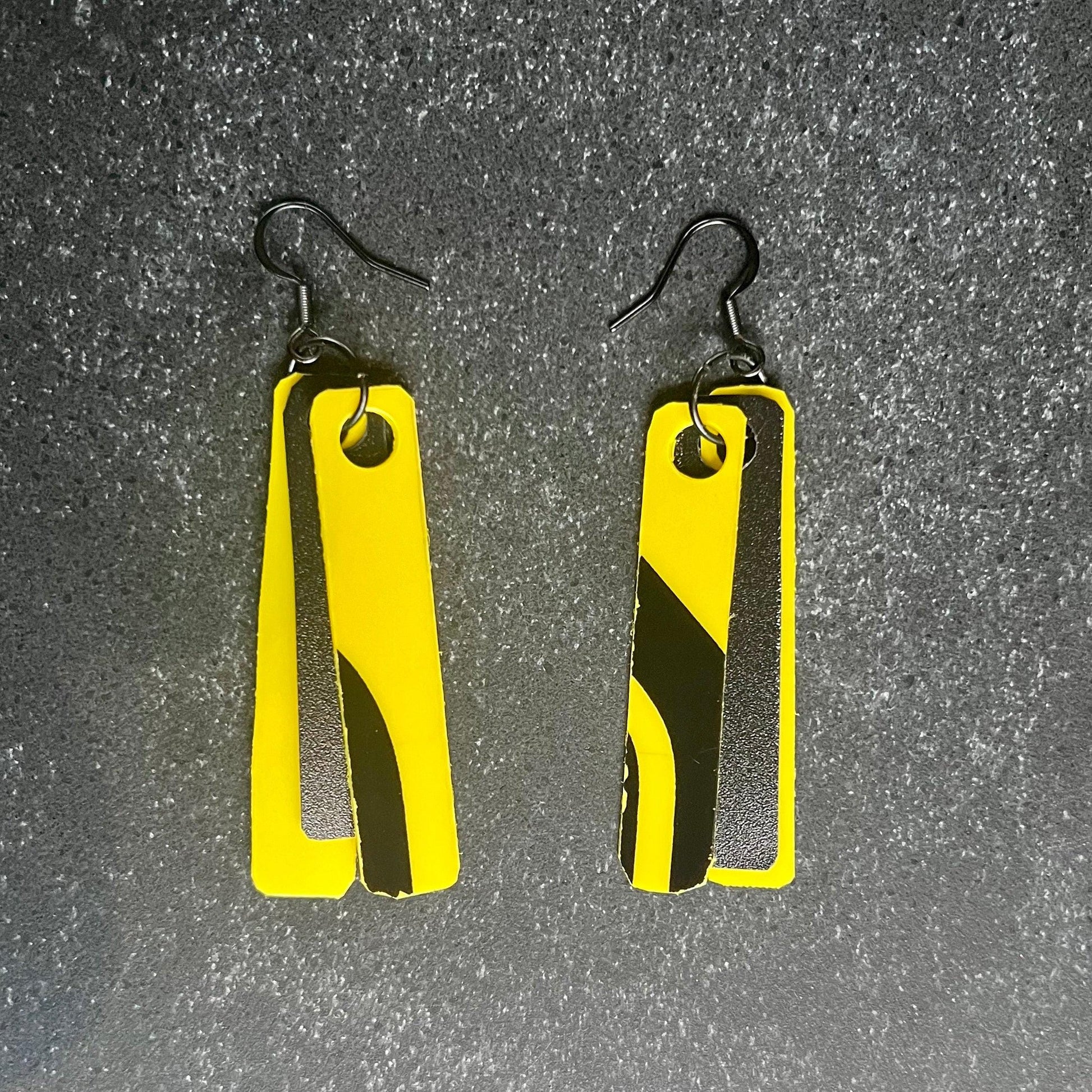 Yellow and black earrings that are extremely lightweight