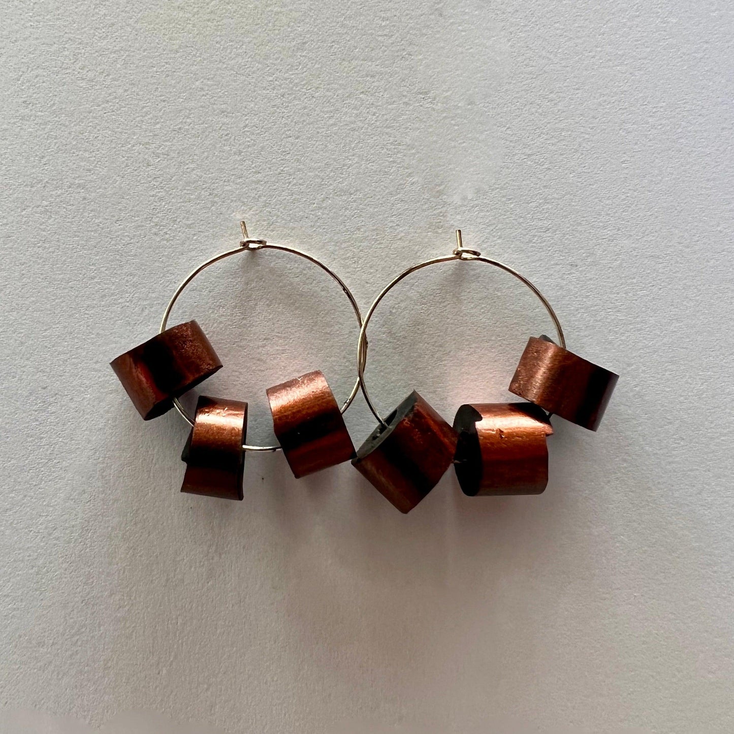 Hand painted rubber tube segments threaded onto earring hoops