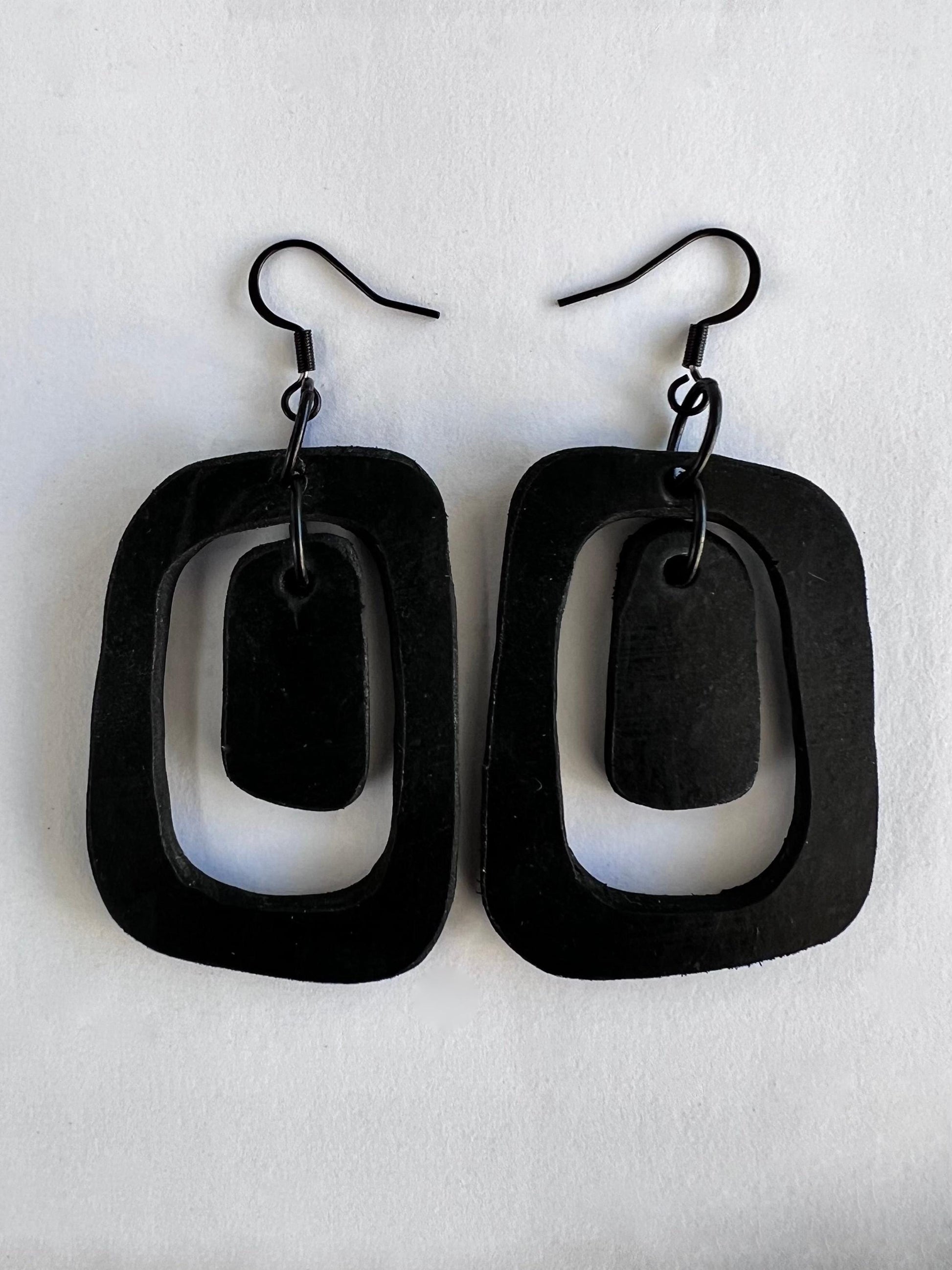 A pair of black rubber earrings