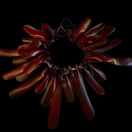 A red rubber frilly necklace