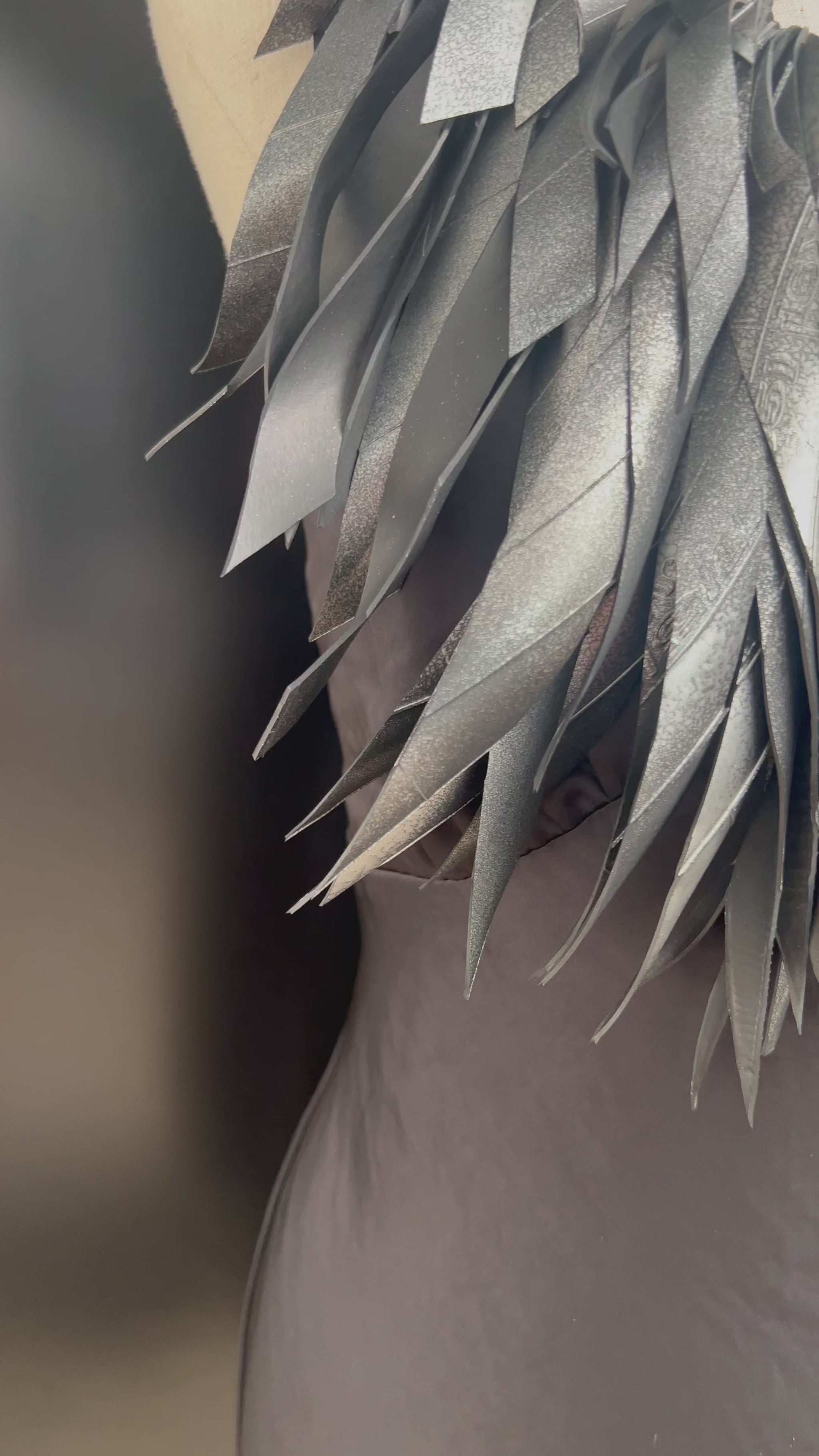 A  video showing a mannequin wears a hand painted large grey silver rubber necklace