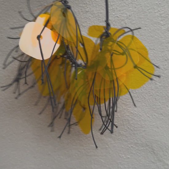 A plastic necklace spins around