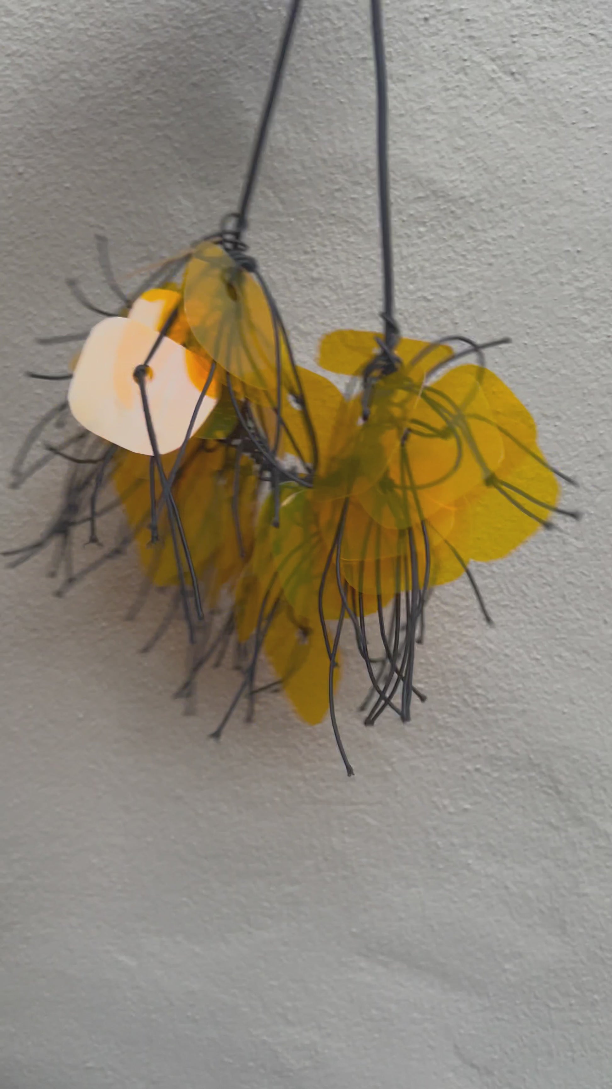 A plastic necklace spins around