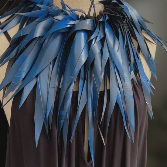 A video showing movement of a large blue rubber necklace