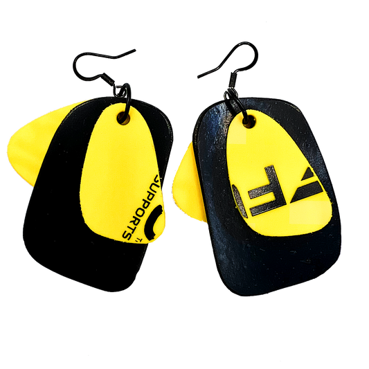 A pair of black and yellow earrings