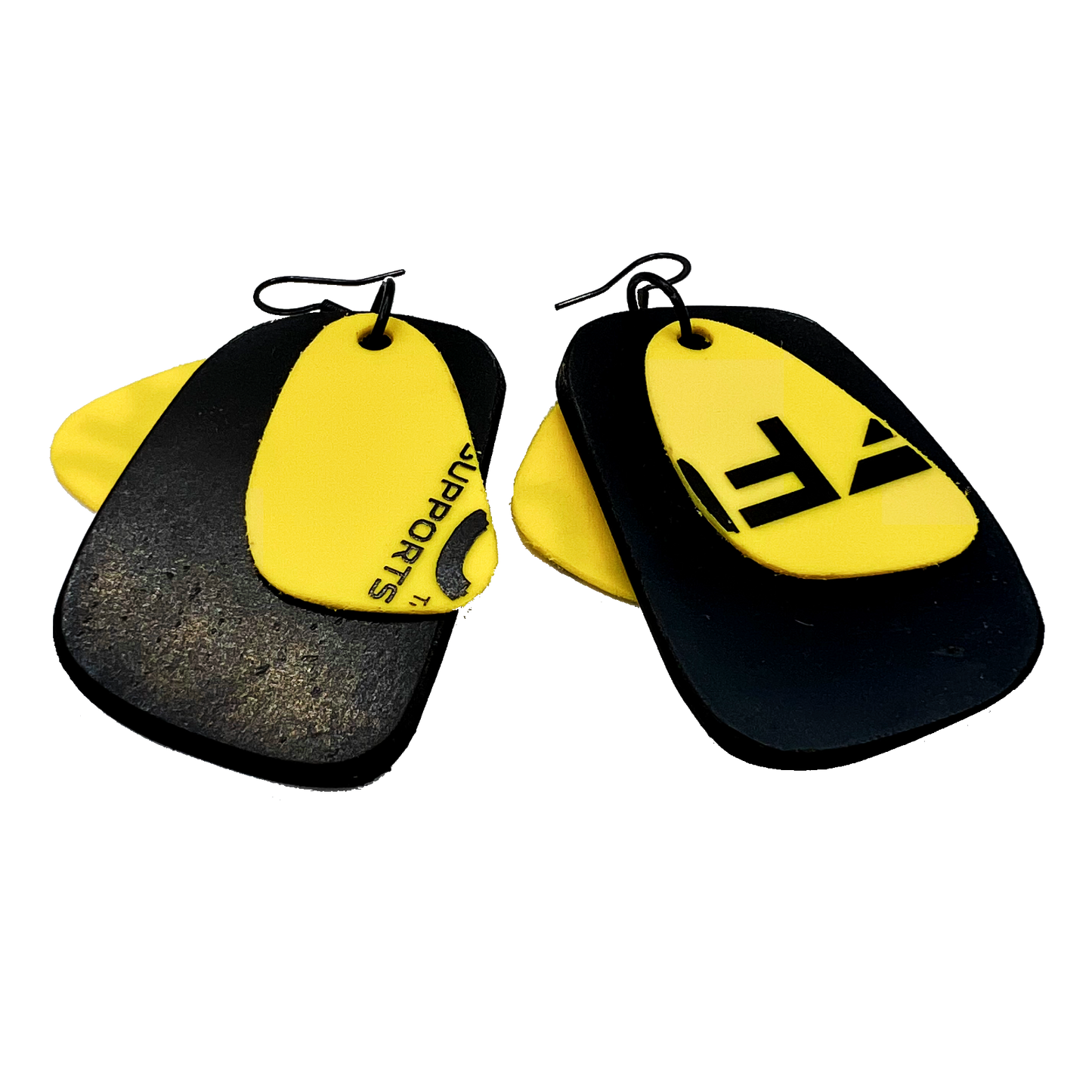 A pair of black and yellow earrings with black graphic print